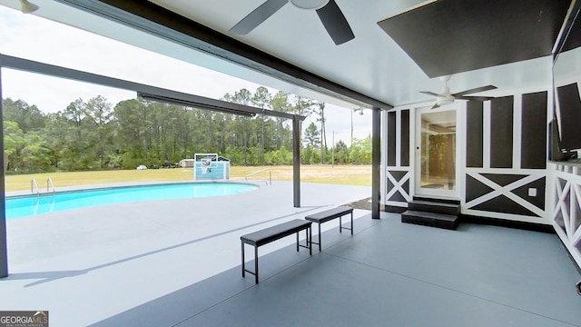 view of swimming pool featuring ceiling fan