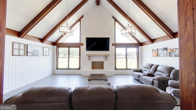 living room featuring a chandelier, beam ceiling, a large fireplace, high vaulted ceiling, and wood finished floors