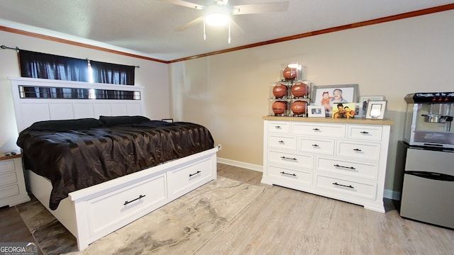 bedroom featuring ornamental molding, light wood-style floors, baseboards, and a ceiling fan