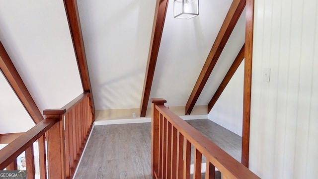 stairway with wood finished floors