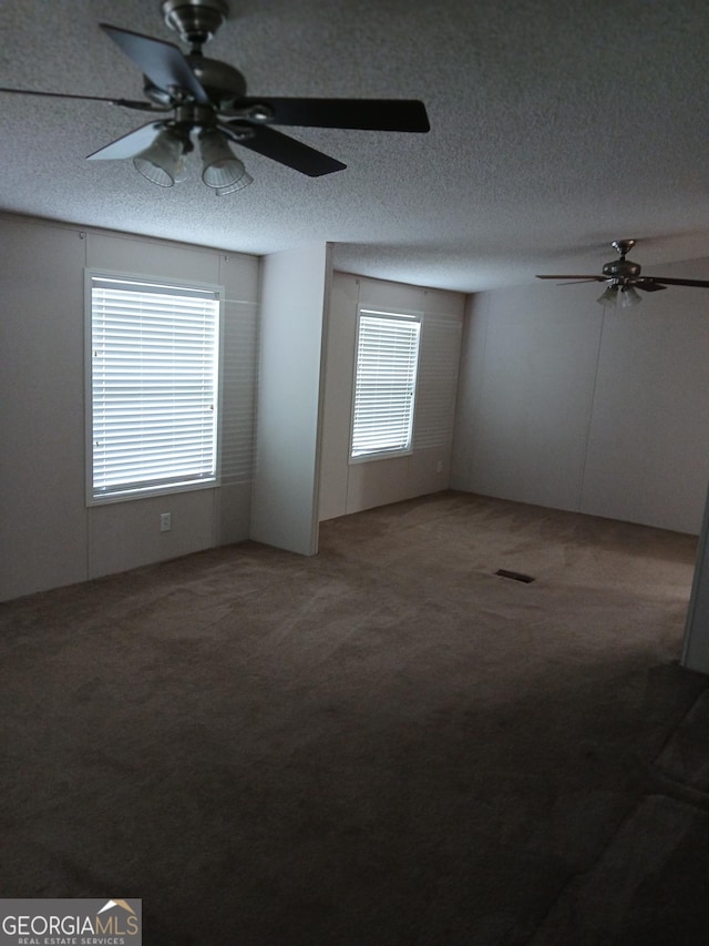 2791 Pulaski Rd, Statesboro, GA 30458 - carpeted spare room featuring a ceiling fan and a textured ceiling
