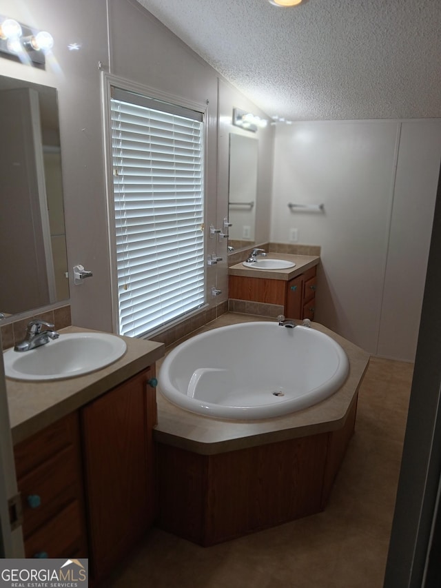 2791 Pulaski Rd, Statesboro, GA 30458 - full bath with vanity, a garden tub, tile patterned floors, and a textured ceiling