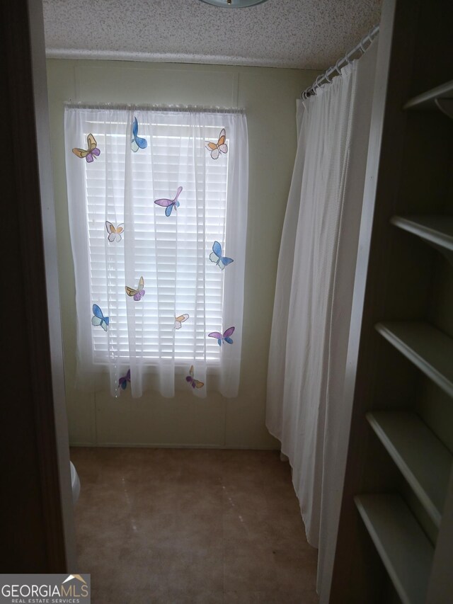 2791 Pulaski Rd, Statesboro, GA 30458 - carpeted spare room with ceiling fan, a textured ceiling, and visible vents