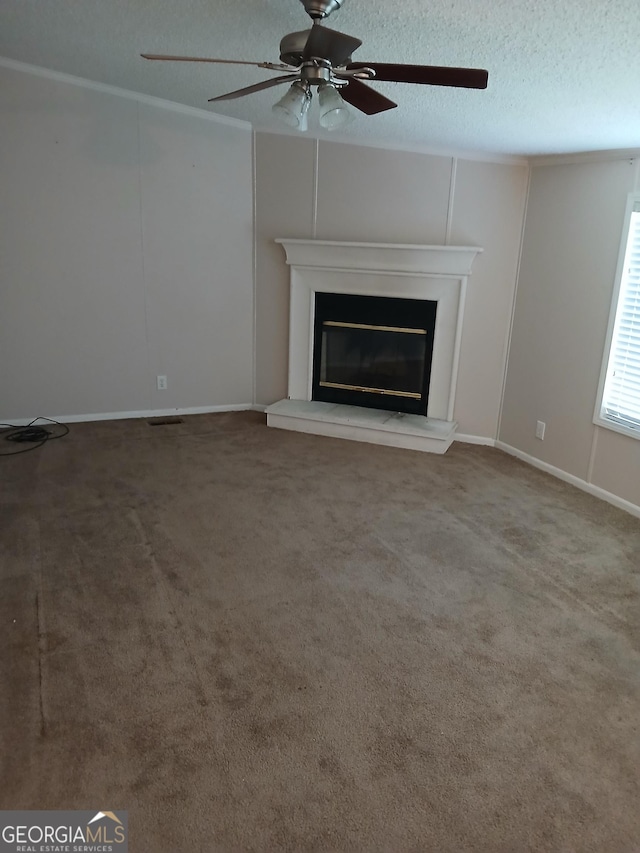 2791 Pulaski Rd, Statesboro, GA 30458 - unfurnished living room with a glass covered fireplace, carpet floors, a ceiling fan, and a textured ceiling