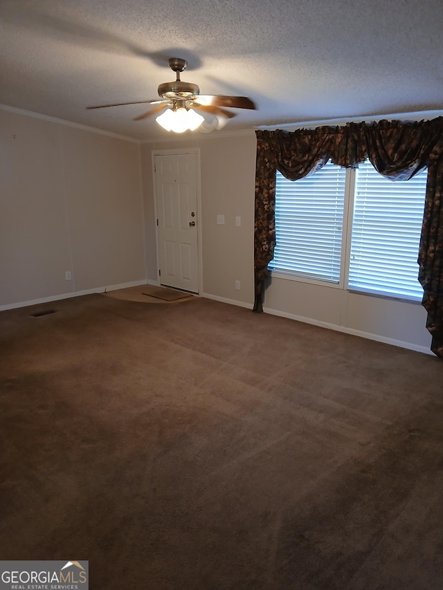 2791 Pulaski Rd, Statesboro, GA 30458 - unfurnished room with ceiling fan, a textured ceiling, crown molding, baseboards, and dark colored carpet