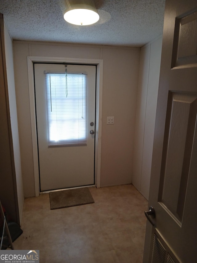 2791 Pulaski Rd, Statesboro, GA 30458 - entryway featuring light floors and a textured ceiling