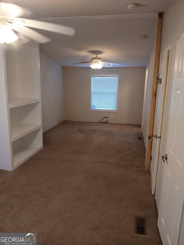 2791 Pulaski Rd, Statesboro, GA 30458 - spare room with a ceiling fan, visible vents, and carpet
