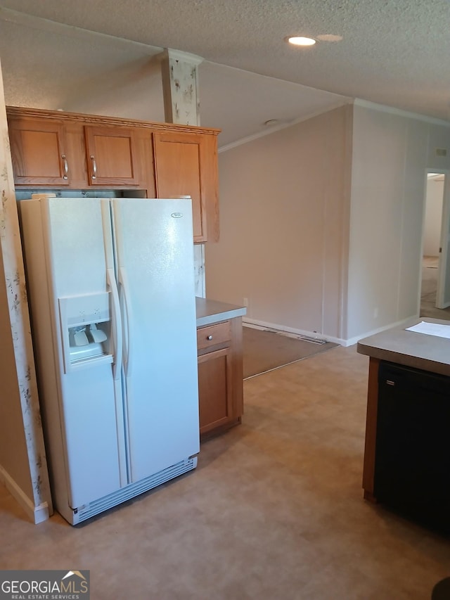 2791 Pulaski Rd, Statesboro, GA 30458 - kitchen featuring brown cabinets, white refrigerator with ice dispenser, light countertops, a textured ceiling, and lofted ceiling