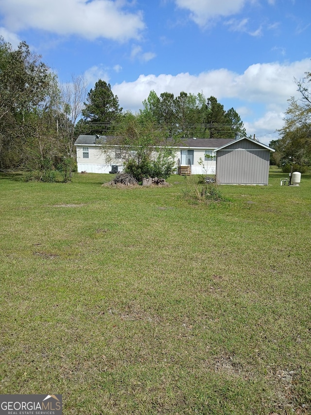 2791 Pulaski Rd, Statesboro, GA 30458 - view of yard with an outbuilding