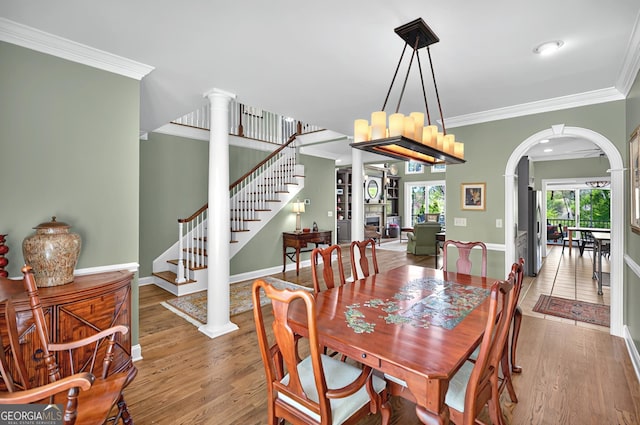 804 Eagleview, Anderson, SC 29625 - dining space featuring decorative columns, wood finished floors, ornamental molding, arched walkways, and stairs
