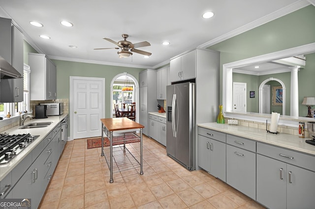 804 Eagleview, Anderson, SC 29625 - kitchen with stainless steel appliances, gray cabinetry, a ceiling fan, backsplash, and crown molding