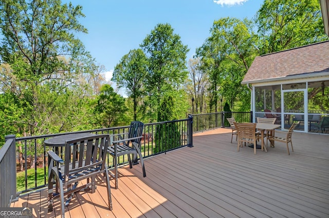 804 Eagleview, Anderson, SC 29625 - wooden terrace with outdoor dining area, a sunroom, and view of wooded area