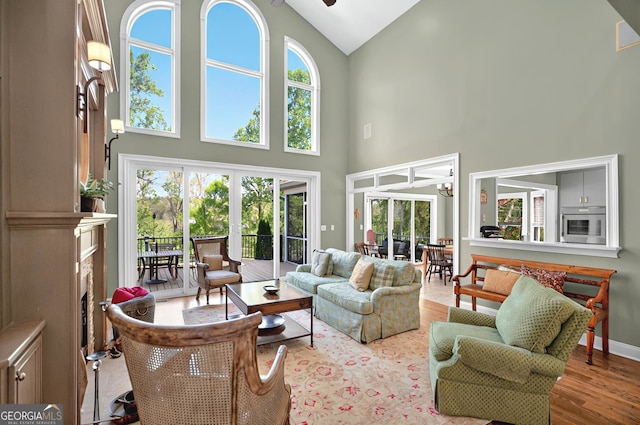 804 Eagleview, Anderson, SC 29625 - living area featuring high vaulted ceiling, healthy amount of natural light, wood finished floors, and a ceiling fan