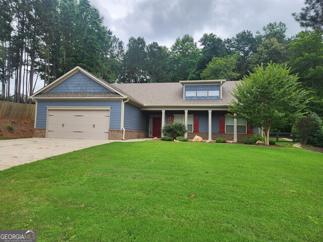 328 Spence Cir, Ball Ground, GA 30107 - craftsman-style home with an attached garage, driveway, brick siding, covered porch, and a shingled roof
