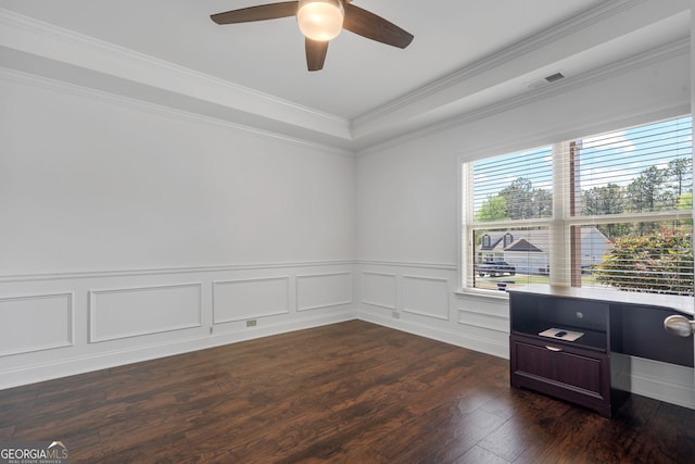 328 Spence Cir, Ball Ground, GA 30107 - unfurnished room featuring a ceiling fan, dark wood-type flooring, ornamental molding, a wainscoted wall, and a raised ceiling