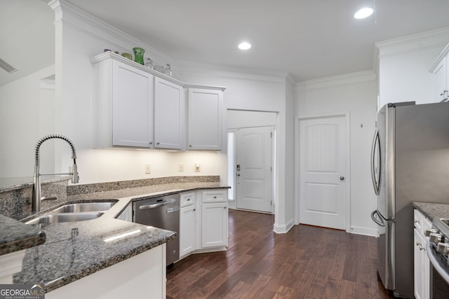 328 Spence Cir, Ball Ground, GA 30107 - kitchen featuring appliances with stainless steel finishes, dark wood-style floors, dark stone countertops, white cabinetry, and recessed lighting