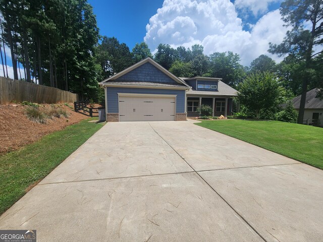 328 Spence Cir, Ball Ground, GA 30107 - craftsman-style house with concrete driveway, a garage, and brick siding