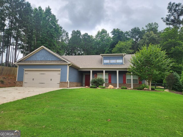 328 Spence Cir, Ball Ground, GA 30107 - view of front of property featuring a garage, brick siding, driveway, and a porch