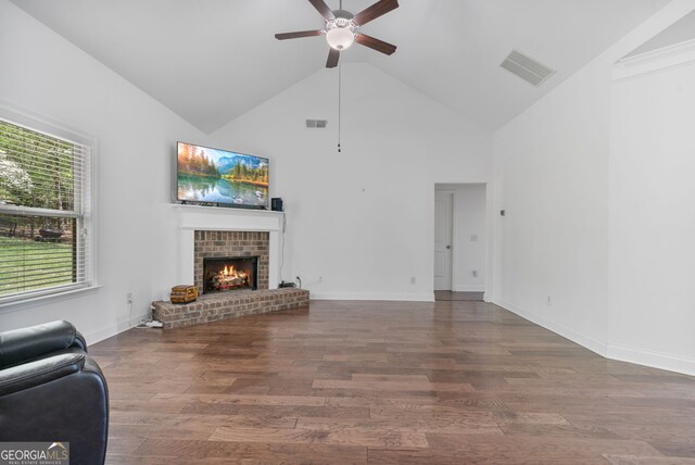 328 Spence Cir, Ball Ground, GA 30107 - kitchen featuring ceiling fan, open floor plan, vaulted ceiling, a kitchen bar, and light stone countertops