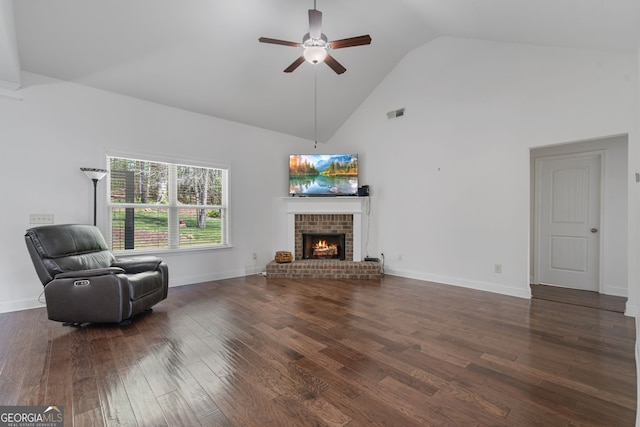 328 Spence Cir, Ball Ground, GA 30107 - living room featuring a ceiling fan, high vaulted ceiling, wood finished floors, and a brick fireplace