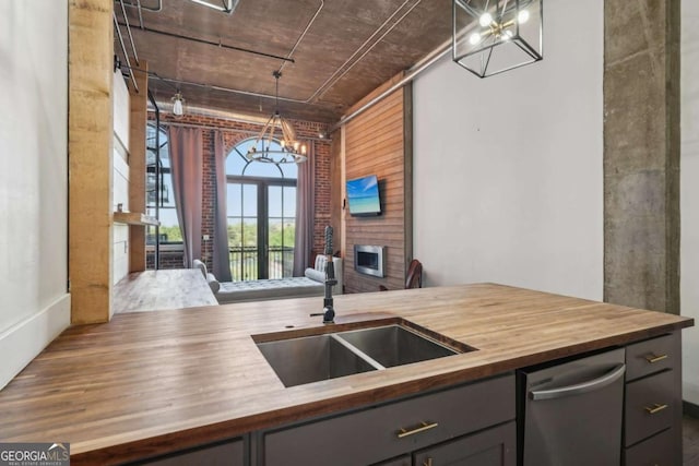 kitchen featuring a sink, visible vents, wood counters, and stainless steel appliances