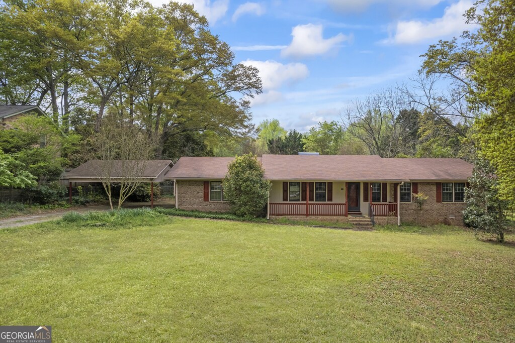 160 Landor Dr, Athens, GA 30606 - single story home with a carport, brick siding, a front lawn, and covered porch