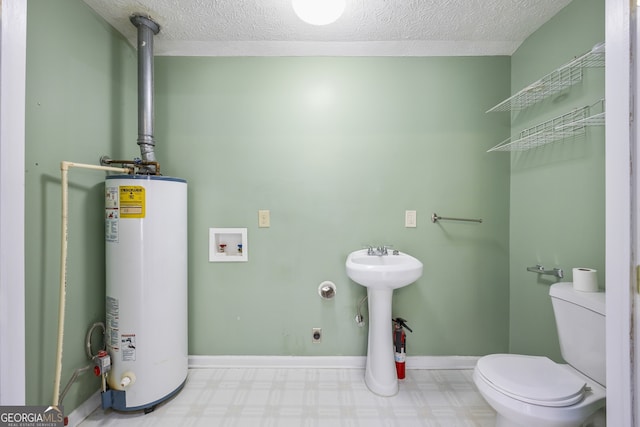 bathroom featuring water heater, baseboards, tile patterned floors, a textured ceiling, and toilet