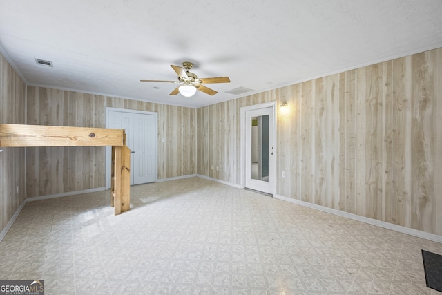 unfurnished living room featuring tile patterned floors, baseboards, and a ceiling fan