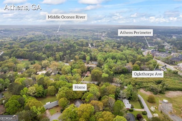 birds eye view of property with a view of trees