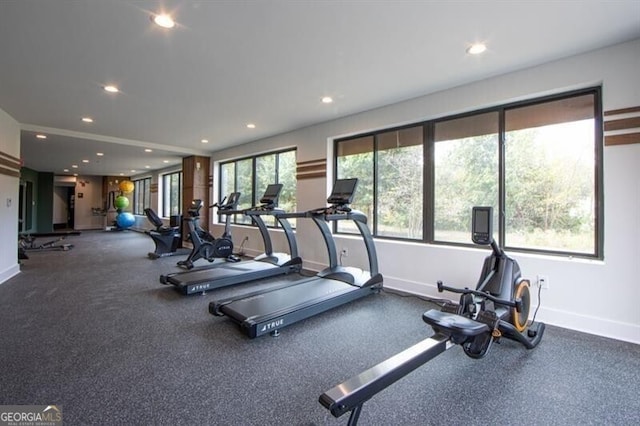 gym with baseboards and recessed lighting