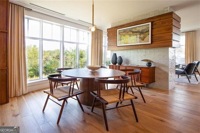 dining area featuring light wood finished floors
