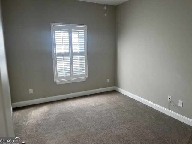 155 Martello Rd, Pooler, GA 31322 - spare room featuring dark carpet and baseboards