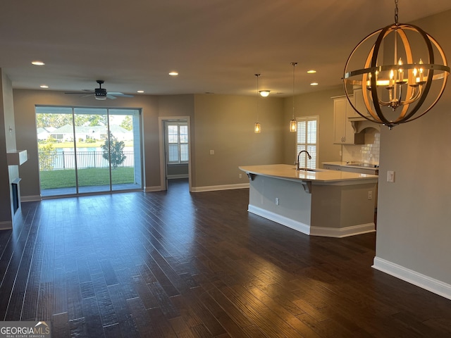155 Martello Rd, Pooler, GA 31322 - kitchen featuring a wealth of natural light, white cabinetry, a center island with sink, and dark wood-style floors