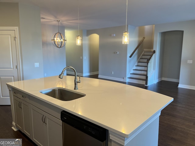155 Martello Rd, Pooler, GA 31322 - kitchen with stainless steel dishwasher, dark wood finished floors, light countertops, a sink, and a center island with sink