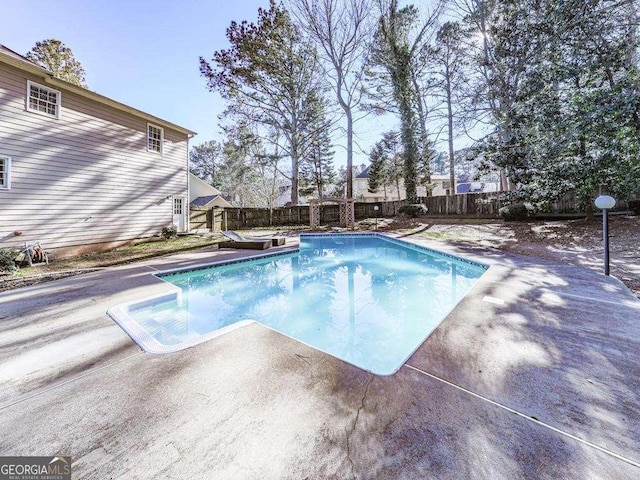view of pool with a fenced backyard, a fenced in pool, and a patio