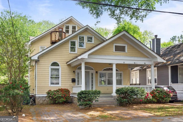 873 Monroe Cir NE, Atlanta, GA 30308 - view of front of property featuring a chimney and covered porch