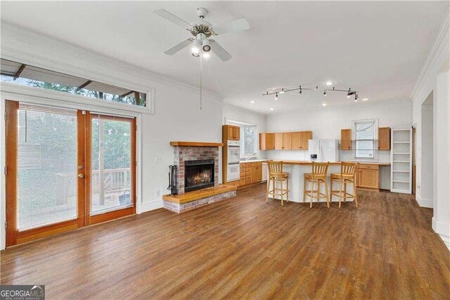 873 Monroe Cir NE, Atlanta, GA 30308 - kitchen featuring crown molding, dark wood-style flooring, and white appliances