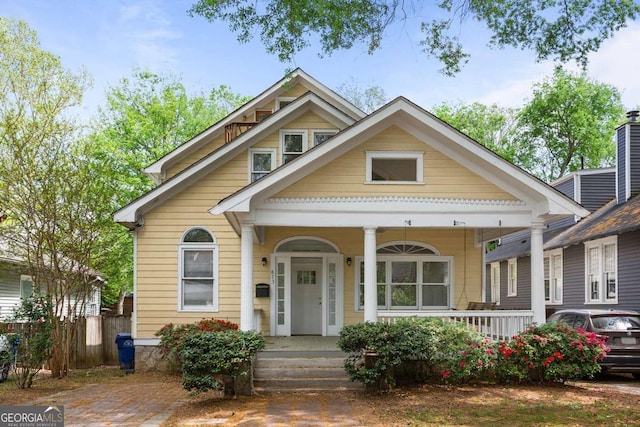 873 Monroe Cir NE, Atlanta, GA 30308 - view of front facade with covered porch and fence