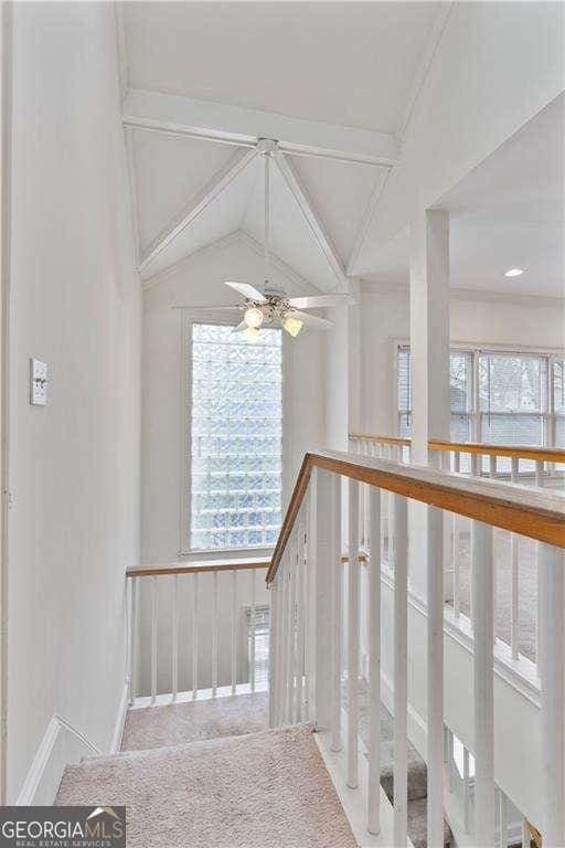 873 Monroe Cir NE, Atlanta, GA 30308 - stairs featuring a ceiling fan, plenty of natural light, and vaulted ceiling