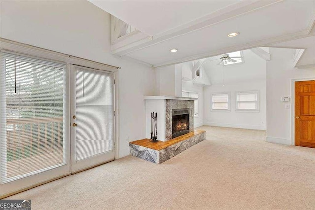 873 Monroe Cir NE, Atlanta, GA 30308 - carpeted living area with ceiling fan, lofted ceiling with beams, a fireplace, recessed lighting, and baseboards