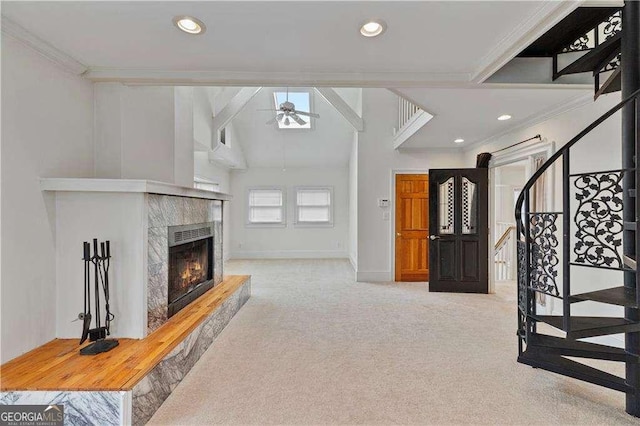 873 Monroe Cir NE, Atlanta, GA 30308 - carpeted living room featuring a fireplace, baseboards, crown molding, and ceiling fan