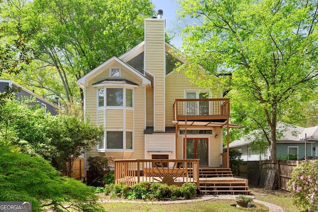 873 Monroe Cir NE, Atlanta, GA 30308 - rear view of property with french doors, a balcony, fence, and a chimney