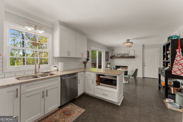 503 Duke Dr, Marietta, GA 30066 - kitchen with tasteful backsplash, a peninsula, white cabinetry, appliances with stainless steel finishes, and a sink