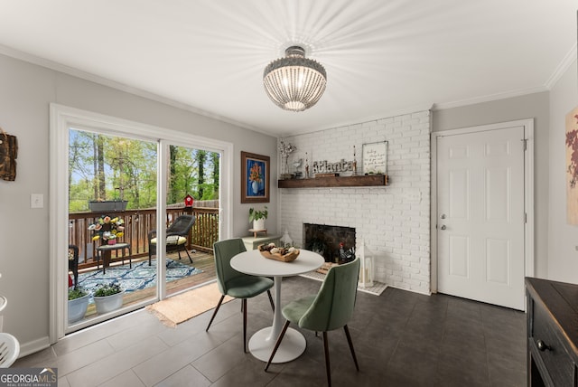 503 Duke Dr, Marietta, GA 30066 - dining room with an inviting chandelier, ornamental molding, and a brick fireplace