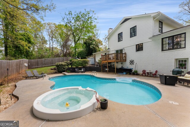 503 Duke Dr, Marietta, GA 30066 - view of swimming pool featuring a pool with connected hot tub, a diving board, a fenced backyard, grilling area, and a patio area