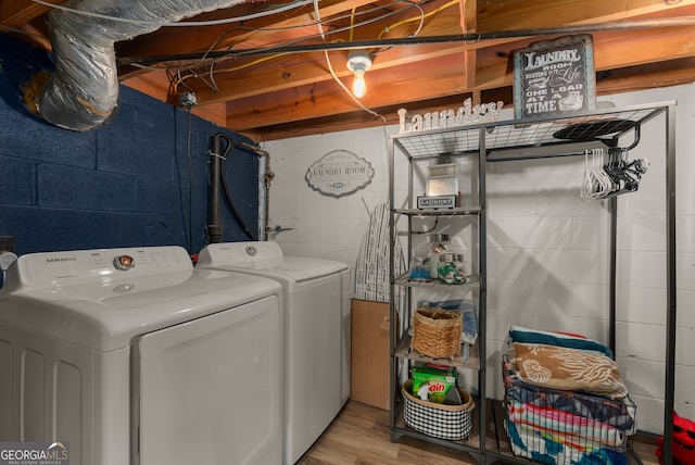 503 Duke Dr, Marietta, GA 30066 - laundry room featuring washer and clothes dryer, laundry area, and wood finished floors