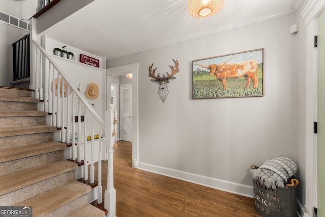 503 Duke Dr, Marietta, GA 30066 - stairs with visible vents, baseboards, crown molding, and wood finished floors