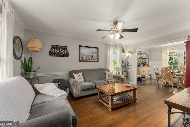 503 Duke Dr, Marietta, GA 30066 - living room featuring crown molding, wood finished floors, and ceiling fan with notable chandelier