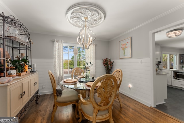 503 Duke Dr, Marietta, GA 30066 - dining space featuring an inviting chandelier, ornamental molding, a wainscoted wall, and dark wood-style flooring