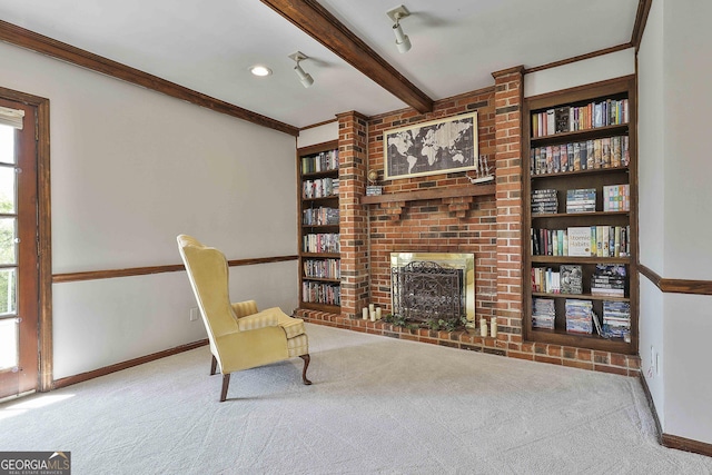 31 Festiva Dr, Newnan, GA 30263 - sitting room featuring built in shelves, baseboards, carpet, crown molding, and beam ceiling